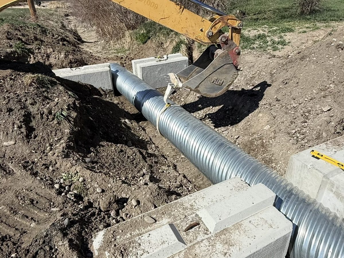 Culvert pipe set to grade with concrete block headwalls