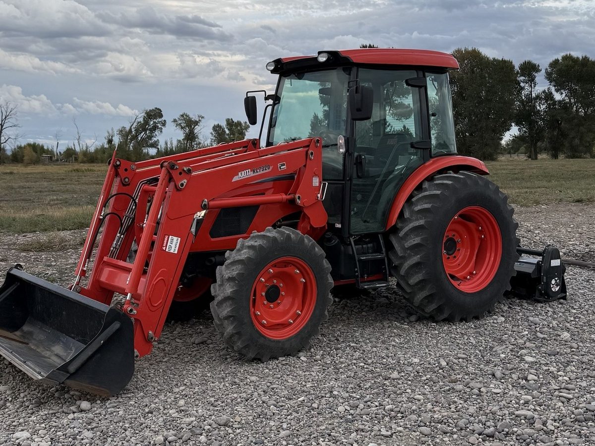 Tractor with loader and tiller for ground prep after clearing
