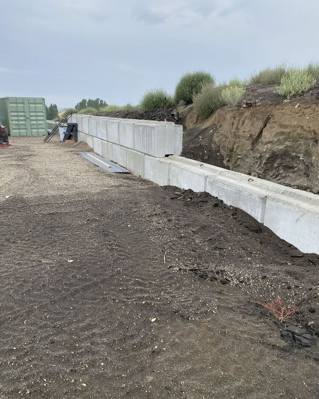 Concrete block retaining wall built into a slope in East Idaho